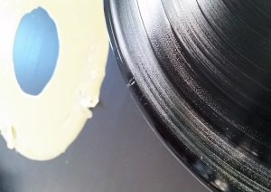 Residual wood glue on vinyl record