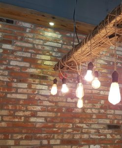 Edison bulbs, brick, and reclaimed wood